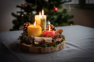 Nice,Christmas,Centerpiece,With,Burning,Candles,,Behind,Is,The,Christmas