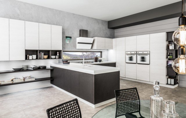 La penisola di Oriente di Arrex Le Cucine crea un piacevole effetto “continuità” con gli elementi del living. I grandi pensili e le colonne hanno le ante effetto legno finitura Igloo in contrasto con le basi effetto cemento finitura Brulè. La gola e lo zoccolo sono in metallo laccato bianco e il piano di lavoro è in Unicolor Bianco Dax-Stone. Prezzo su richiesta. www.arrex.it La penisola di Oriente di Arrex Le Cucine crea un piacevole effetto “continuità” con gli elementi del living. I grandi pensili e le colonne hanno le ante effetto legno finitura Igloo in contrasto con le basi effetto cemento finitura Brulè. La gola e lo zoccolo sono in metallo laccato bianco e il piano di lavoro è in Unicolor Bianco Dax-Stone. Prezzo su richiesta. www.arrex.it