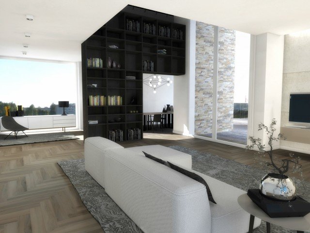 Il grande spazio è ripartito e organizzato grazie a una libreria a tutta altezza, il sistema autoportante Selecta (progetto di Officinadesign Lema), con sviluppo a ponte. Una soluzione di segno deciso, capace di catalizzare l’attenzione senza interrompere la prospettiva, ma soprattutto in grado di organizzare al meglio libri e oggetti. Al centro dell’ambiente il divano Cloud (design Francesco Rota), un confortevole sistema di sedute componibili qui in versione compatta. Contraddistinto da volumi generosi dalle curve arrotondate, asseconda la massima personalizzazione grazie a undici moduli e a tre tipologie di braccioli, di dimensioni, forma e altezza differenti. A fianco del divano, è sistemato il tavolino Flowers (design Roberto Lazzeroni) con piano in legno laccato opaco e struttura in metallo verniciato nero, che conferisce leggerezza e aggiunge un tocco di stile con le sue linee anni Cinquanta. Davanti alla vetrata fissa a tutta altezza, una madia T030 (design Piero Lissoni), sollevata da terra da una base metallica e dotata di ante a battente e di cassetti di ampie dimensioni, lascia aperta la visuale panoramica sull'esterno. Il materico top in finitura cemento conferisce all’insieme un tratto estremamente contemporaneo. Il grande spazio è ripartito e organizzato grazie a una libreria a tutta altezza, il sistema autoportante Selecta (progetto di Officinadesign Lema), con sviluppo a ponte. Una soluzione di segno deciso, capace di catalizzare l’attenzione senza interrompere la prospettiva, ma soprattutto in grado di organizzare al meglio libri e oggetti. Al centro dell’ambiente il divano Cloud (design Francesco Rota), un confortevole sistema di sedute componibili qui in versione compatta. Contraddistinto da volumi generosi dalle curve arrotondate, asseconda la massima personalizzazione grazie a undici moduli e a tre tipologie di braccioli, di dimensioni, forma e altezza differenti. A fianco del divano, è sistemato il tavolino Flowers (design Roberto Lazzeroni) con piano in legno laccato opaco e struttura in metallo verniciato nero, che conferisce leggerezza e aggiunge un tocco di stile con le sue linee anni Cinquanta. Davanti alla vetrata fissa a tutta altezza, una madia T030 (design Piero Lissoni), sollevata da terra da una base metallica e dotata di ante a battente e di cassetti di ampie dimensioni, lascia aperta la visuale panoramica sull'esterno. Il materico top in finitura cemento conferisce all’insieme un tratto estremamente contemporaneo.