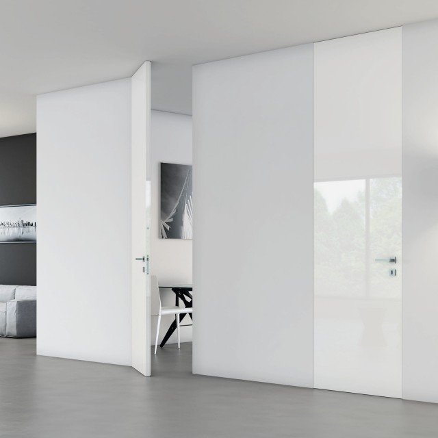 La porta Walldoor, con telaio Massima fasciante il muro di Bertolotto ha anta laccata lucida. Larga da 60 a 110 cm, costa a partire da 960 euro La porta Walldoor, con telaio Massima fasciante il muro di Bertolotto ha anta laccata lucida. Larga da 60 a 110 cm, costa a partire da 960 euro