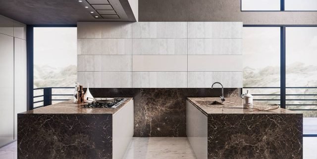 Volumia di Febal Casa è la cucina che si sviluppa su due linee, due penisole parallele su cui trovano posto rispettivamente la zona lavaggio e quella di cottura. Gli elementi hanno una forma compatta e squadrata, le ante in laccato lucido Grigio città hanno la presa maniglia ricavata con una speciale lavorazione della superficie che rende la materia protagonista. Tutti i piani sono realizzati in pregiato marmo Emperador marrone lucido. Un modulo base da 60 cm, prezzo 240 euro. www.febalcasa.com Volumia di Febal Casa è la cucina che si sviluppa su due linee, due penisole parallele su cui trovano posto rispettivamente la zona lavaggio e quella di cottura. Gli elementi hanno una forma compatta e squadrata, le ante in laccato lucido Grigio città hanno la presa maniglia ricavata con una speciale lavorazione della superficie che rende la materia protagonista. Tutti i piani sono realizzati in pregiato marmo Emperador marrone lucido. Un modulo base da 60 cm, prezzo 240 euro. www.febalcasa.com