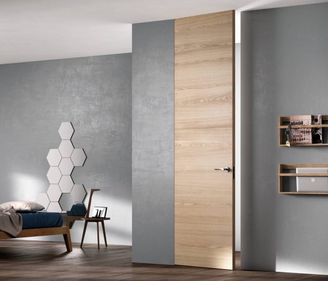 Porta Exit Zero della linea Sistema Zero di FerreroLegno, con telaio “A_filo” completamente integrato nel muro, nella finitura Rovere Natural Touch. Dimensioni: 80×290 cm. Porta Exit Zero della linea Sistema Zero di FerreroLegno, con telaio “A_filo” completamente integrato nel muro, nella finitura Rovere Natural Touch. Dimensioni: 80×290 cm.