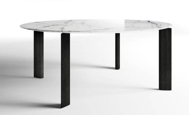Fourdrops di Driade, design Gabriele e Oscar Buratti, è il tavolo che ha le gambe con sezione a goccia e il piano arrotondato realizzato in pregiato marmo venato. www.driade.com Fourdrops di Driade, design Gabriele e Oscar Buratti, è il tavolo che ha le gambe con sezione a goccia e il piano arrotondato realizzato in pregiato marmo venato. www.driade.com