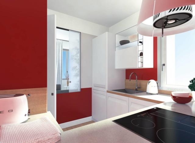 La cucina è luminosa, grazie anche agli arredi chiari e all'anta in vetro satinato del passavivande. Nella composizione, a eccezione della colonna frigo, le pareti sono occupate da basi su tre lati, più un pensile sopra il lavello, con vani a giorno e chiusi. L'ampio piano lavoro è protetto da una alzata in legno, mentre la cappa è un modello a isola. Le pareti sono dipinte con smalto all'acqua rosso satinato; il pavimento è in gres porcellanato effetto legno. • Porta scorrevole a scomparsa parziale e controtelaio (per il vano passavivande) di Scrigno (www.scrigno.it), piano cottura Crystal di Franke (www.franke.it), cappa Grace di Elica (www.elica.it), lavello di Foster (www.fosterspa.it), piccoli elettrodomestici di Smeg (www.smeg.it). La cucina è luminosa, grazie anche agli arredi chiari e all'anta in vetro satinato del passavivande. Nella composizione, a eccezione della colonna frigo, le pareti sono occupate da basi su tre lati, più un pensile sopra il lavello, con vani a giorno e chiusi. L'ampio piano lavoro è protetto da una alzata in legno, mentre la cappa è un modello a isola. Le pareti sono dipinte con smalto all'acqua rosso satinato; il pavimento è in gres porcellanato effetto legno. • Porta scorrevole a scomparsa parziale e controtelaio (per il vano passavivande) di Scrigno (www.scrigno.it), piano cottura Crystal di Franke (www.franke.it), cappa Grace di Elica (www.elica.it), lavello di Foster (www.fosterspa.it), piccoli elettrodomestici di Smeg (www.smeg.it).