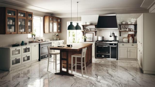 Favilla di Scavolini è la cucina caratterizzata da uno stile tradizionale che rende l'ambiente familiare e accogliente: al centro trova posto la grande isola monoblocco in Rovere Nodato con bancone snack. Favilla di Scavolini è la cucina caratterizzata da uno stile tradizionale che rende l'ambiente familiare e accogliente: al centro trova posto la grande isola monoblocco in Rovere Nodato con bancone snack.