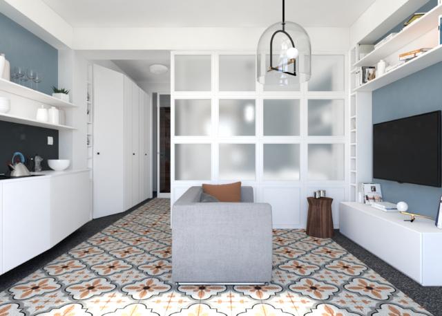 Soggiorno cucina con pavimentazione in piastrelle di piccolo formato e ad effetto graniglia che forma un rettangolo decorativo colorato centrale al quale si affiancano fasce laterali scure che lo mettono in evidenza come un tappeto. Soggiorno cucina con pavimentazione in piastrelle di piccolo formato e ad effetto graniglia che forma un rettangolo decorativo colorato centrale al quale si affiancano fasce laterali scure che lo mettono in evidenza come un tappeto.