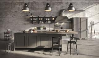 cucina Bellagio di Aran Cucine stile industrial come il piano di lavoro in acciaio e la grande cappa Officina con camino squadrato; ante hanno il telaio massello e la bugna impiallacciata in frassino in una raffinata tonalità di grigio cucina Bellagio di Aran Cucine stile industrial come il piano di lavoro in acciaio e la grande cappa Officina con camino squadrato; ante hanno il telaio massello e la bugna impiallacciata in frassino in una raffinata tonalità di grigio