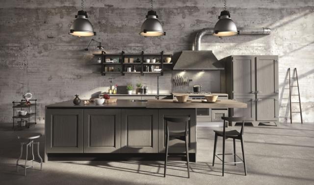 cucina Bellagio di Aran Cucine stile industrial come il piano di lavoro in acciaio e la grande cappa Officina con camino squadrato; ante hanno il telaio massello e la bugna impiallacciata in frassino in una raffinata tonalità di grigio cucina Bellagio di Aran Cucine stile industrial come il piano di lavoro in acciaio e la grande cappa Officina con camino squadrato; ante hanno il telaio massello e la bugna impiallacciata in frassino in una raffinata tonalità di grigio
