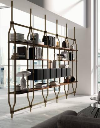 Dettagli curati per la libreria componibile con fissaggio a soffitto Charlotte di Bontempi che divide in due zone il living e permette di esporre libri e oggetti; ha la struttura realizzata in acciaio laccato ottone anticato e ha quattordici ripiani in legno impiallacciato noce e tre contenitori sospesi opzionali nella finitura nero opaco come i dettagli decorativi. Misura L 410 x P 37 x H 233 cm. Prezzo a partire da 10.271 euro. www.bontempi.it Dettagli curati per la libreria componibile con fissaggio a soffitto Charlotte di Bontempi che divide in due zone il living e permette di esporre libri e oggetti; ha la struttura realizzata in acciaio laccato ottone anticato e ha quattordici ripiani in legno impiallacciato noce e tre contenitori sospesi opzionali nella finitura nero opaco come i dettagli decorativi. Misura L 410 x P 37 x H 233 cm. Prezzo a partire da 10.271 euro. www.bontempi.it