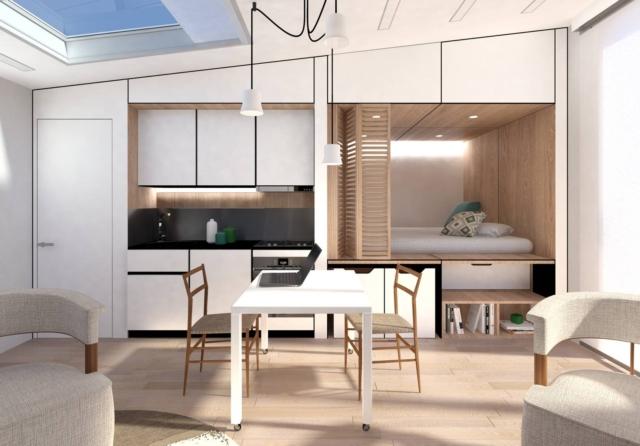 Monolocale con tavolo su ruote, sedie design, cucina bianca, letto nascosto in nicchia chiusa da pannello in legno Monolocale con tavolo su ruote, sedie design, cucina bianca, letto nascosto in nicchia chiusa da pannello in legno