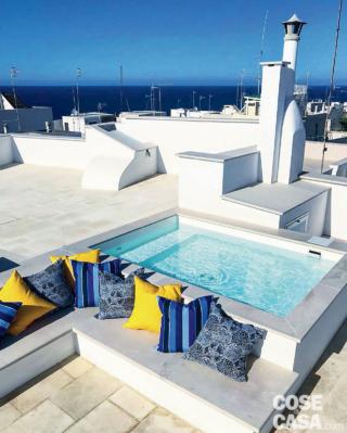 lastrico solare, terrazzo, vista panoramica, mini piscina in muratura, solarium, panche, cuscini