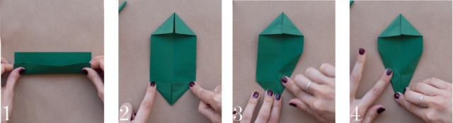 1) Ripiegare verso l’alto la carta rettangolare rimasta e aprire la piegatura.
2) Piegare in dentro due angoli del foglio ottenendo una punta, ripetere sull’altro lato.
3-4) Solo da una parte, piegare entrambi i lati verso il centro, con delle piegature oblique. 1) Ripiegare verso l’alto la carta rettangolare rimasta e aprire la piegatura.
2) Piegare in dentro due angoli del foglio ottenendo una punta, ripetere sull’altro lato.
3-4) Solo da una parte, piegare entrambi i lati verso il centro, con delle piegature oblique.