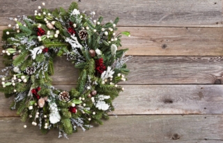 Christmas Wreath hung on barn board background. Copy space. Christmas Wreath hung on barn board background. Copy space.