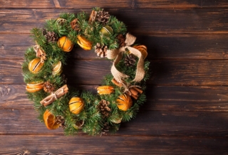 Christmas aromatic eco wreath with dry orange and cinnamon sticks, closeup details Christmas aromatic eco wreath with dry orange and cinnamon sticks, closeup details