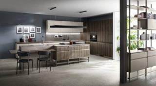 La cucina a isola Formalia di Scavolini, design Vittore Niolu, è caratterizzata da un design rigoroso e contemporaneo, sottolineato dalle ante sagomate in laccato opaco Grigio Chiaro e decorativo Noce Garden. Il top è in gres porcellanato Pietra Piasentina Grigio Naturale; le maniglie sono in metallo con profilo titanio. Il Sistema Parete Status ha la struttura color Titanio e i pensili in laccato Grigio Chiaro. www.scavolini.com La cucina a isola Formalia di Scavolini, design Vittore Niolu, è caratterizzata da un design rigoroso e contemporaneo, sottolineato dalle ante sagomate in laccato opaco Grigio Chiaro e decorativo Noce Garden. Il top è in gres porcellanato Pietra Piasentina Grigio Naturale; le maniglie sono in metallo con profilo titanio. Il Sistema Parete Status ha la struttura color Titanio e i pensili in laccato Grigio Chiaro. www.scavolini.com