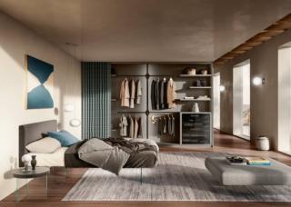 Le ante dell'originale armadio Et Voilà di Lago sono sostituite da un tessuto steso che dà vita ad una parete tessile che, una volta aperta, rivela completamente gli ampi interni. I sistemi di scorrimento sono silenziosi e funzionali grazie ai binari orizzontali invisibili. Il tessuto Stratus, morbido e raffinato, è realizzato con filati tecnici resistenti alla polvere e all'usura, inoltre è fonoassorbente. È progettabile e personalizzabile al millimetro. Misura L 406 x P 65,4 x H 265 cm. Prezzo su richiesta. www.lago.it