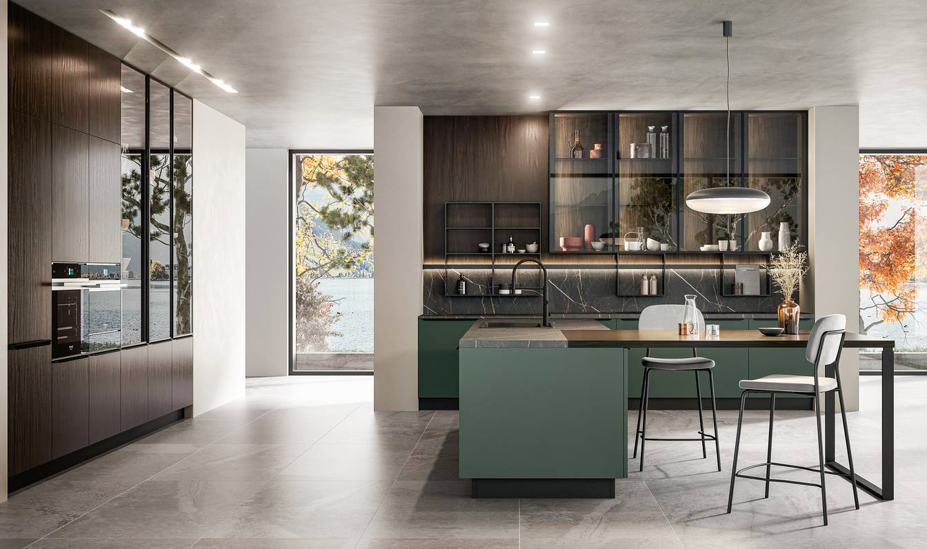 La cucina Kalì 04 di Arredo3 è composta da due blocchi separati: una zona lineare con l'area cottura e un'isola, con le ante in Pet riciclato verde Amazonia, corredata di un piano snack in laminato noce bruno sul supporto Star in metallo nero. Le colonne e i pensili con le ante Teca in vetro trasparente si trasformano in un'ampia vetrina in cui esporre stoviglie e accessori. Prezzo su richiesta. www.arredo3.it La cucina Kalì 04 di Arredo3 è composta da due blocchi separati: una zona lineare con l'area cottura e un'isola, con le ante in Pet riciclato verde Amazonia, corredata di un piano snack in laminato noce bruno sul supporto Star in metallo nero. Le colonne e i pensili con le ante Teca in vetro trasparente si trasformano in un'ampia vetrina in cui esporre stoviglie e accessori. Prezzo su richiesta. www.arredo3.it