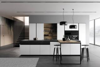 Forme moderne ed essenziali per il modello Glass 2.0 di Arredo3 caratterizzato dalla presenza delle ante delle basi e delle colonne con apertura a gola in alluminio nero e pannello in vetro opaco bianco puro che garantisce durata e resistenza; il vetro inoltre è igienico, facile da pulire e molto luminoso. La boiserie LAB e il piano snack in laminato noce Imperial sottolineano il candore della composizione. Il top è realizzato in HPL 860 black Kandia. Prezzo da rivenditore. www.arredo3.it Forme moderne ed essenziali per il modello Glass 2.0 di Arredo3 caratterizzato dalla presenza delle ante delle basi e delle colonne con apertura a gola in alluminio nero e pannello in vetro opaco bianco puro che garantisce durata e resistenza; il vetro inoltre è igienico, facile da pulire e molto luminoso. La boiserie LAB e il piano snack in laminato noce Imperial sottolineano il candore della composizione. Il top è realizzato in HPL 860 black Kandia. Prezzo da rivenditore. www.arredo3.it