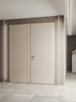 Porta blindata Thor con rivestimento interno intagliata N2 della collezione essenza legno, apertura a battente, finitura in rovere laccato poro aperto sabbia con maniglia Quadra di serie. Porta blindata Thor con rivestimento interno intagliata N2 della collezione essenza legno, apertura a battente, finitura in rovere laccato poro aperto sabbia con maniglia Quadra di serie.