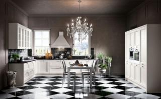 La cucina componibile angolare Divina in vendita da Conforama ha le ante bianche modanate che ne sottolineano lo stile elegantemente retrò. È completata dalla presenza di una grande cappa a camino e da una serie di pensili a vetro all'inglese.  La composizione base misura L 255 x P 60 x H 216 cm esclusi gli elettrodomestici, prezzo scontato 2.190 euro. www.conforama.it La cucina componibile angolare Divina in vendita da Conforama ha le ante bianche modanate che ne sottolineano lo stile elegantemente retrò. È completata dalla presenza di una grande cappa a camino e da una serie di pensili a vetro all'inglese.  La composizione base misura L 255 x P 60 x H 216 cm esclusi gli elettrodomestici, prezzo scontato 2.190 euro. www.conforama.it