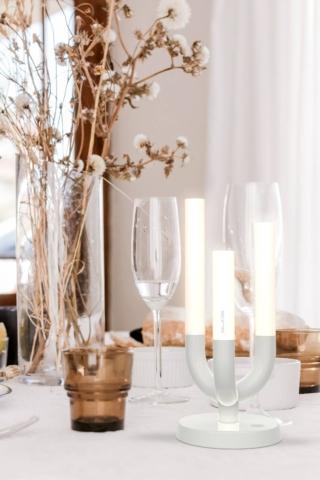 La nuova lampada da tavolo Luna di Slide si ispira nella forma agli antichi candelabri: ha l'aspetto di un trittico di candele che si consumano in modo irregolare. La base è realizzata in alluminio laccato verniciato bianco, gli steli a cilindro sono in plexiglass opaco. È leggera, maneggevole, ricaricabile, dimmerabile e ha una luce a Led calda. Misura L 9,8 x P 9,8 x H 23 cm.    www.slidedesign.it La nuova lampada da tavolo Luna di Slide si ispira nella forma agli antichi candelabri: ha l'aspetto di un trittico di candele che si consumano in modo irregolare. La base è realizzata in alluminio laccato verniciato bianco, gli steli a cilindro sono in plexiglass opaco. È leggera, maneggevole, ricaricabile, dimmerabile e ha una luce a Led calda. Misura L 9,8 x P 9,8 x H 23 cm.    www.slidedesign.it