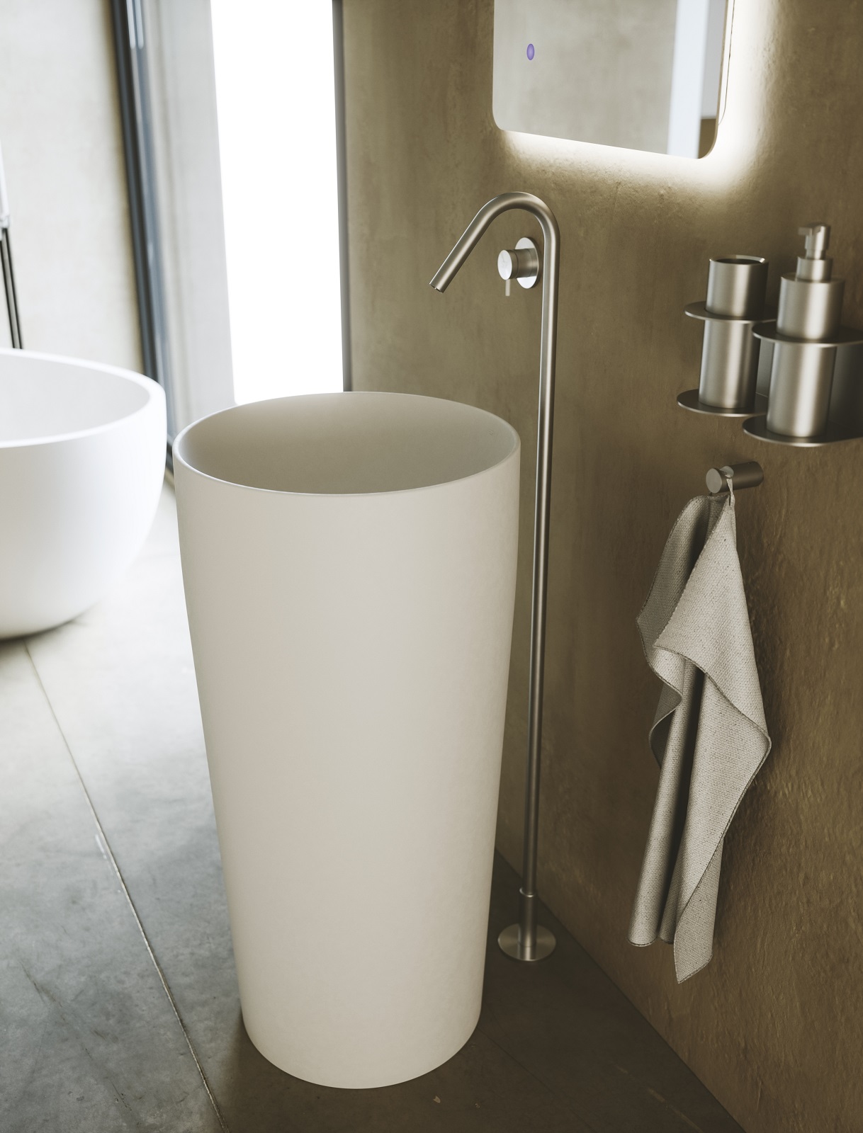 È in ceramica il lavabo freestanding a colonna Flat 5 di SDR Ceramiche con bordo da 5 mm e senza troppopieno. Misura Ø 42 x H 90 cm. Prezzo, Iva esclusa, 1.437 euro. La piletta costa, Iva esclusa, 82 euro. www.sdrceramiche.it