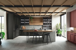 Basi e colonne modello Beverly di Stosa Cucine sono in finitura frassino Moro con maniglia Zen nera. I pensili vetrina hanno telaio in alluminio nero spazzolato e vetro grigio semitrasparente. Il pensile Maxi è il modello Infinity termo-strutturato in finitura Rovere Nodato; la boiserie Linea è in alluminio nero e termo-strutturato in finitura Rovere Nodato, il piano di lavoro Neolit sp. 2 cm finitura Zaha Stone Silk. Elemento Combo Line in alluminio nero e schienale vetro luminoso. Prezzo di una base da 60 cm a partire da 199 euro + Iva. Basi e colonne modello Beverly di Stosa Cucine sono in finitura frassino Moro con maniglia Zen nera. I pensili vetrina hanno telaio in alluminio nero spazzolato e vetro grigio semitrasparente. Il pensile Maxi è il modello Infinity termo-strutturato in finitura Rovere Nodato; la boiserie Linea è in alluminio nero e termo-strutturato in finitura Rovere Nodato, il piano di lavoro Neolit sp. 2 cm finitura Zaha Stone Silk. Elemento Combo Line in alluminio nero e schienale vetro luminoso. Prezzo di una base da 60 cm a partire da 199 euro + Iva.