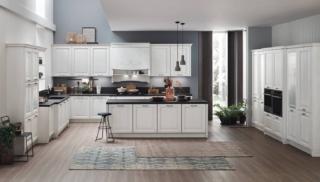 Il modello Lola di Arrex ha le ante bugnate in legno di frassino con finitura décapè bianco Ghiaccio e maniglie in nichel e ceramica bianca; il top, realizzato in laminato Unicolor Nero Marquina effetto pietra, dà vita a un raffinato contrasto. Gli elementi con inserti in vetro aggiungono un tocco romantico e illuminano l'ambiente; la cappa con un decoro frontale sottolinea il sapore artigianale della composizione. Un modulo base da 60 cm con anta modello Lola, prezzo 262 euro + IVA. www.arrex.it Il modello Lola di Arrex ha le ante bugnate in legno di frassino con finitura décapè bianco Ghiaccio e maniglie in nichel e ceramica bianca; il top, realizzato in laminato Unicolor Nero Marquina effetto pietra, dà vita a un raffinato contrasto. Gli elementi con inserti in vetro aggiungono un tocco romantico e illuminano l'ambiente; la cappa con un decoro frontale sottolinea il sapore artigianale della composizione. Un modulo base da 60 cm con anta modello Lola, prezzo 262 euro + IVA. www.arrex.it