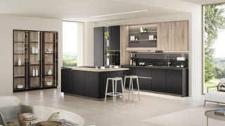 Una raffinata colorazione Nero Soft per le ante delle basi di Start-Time di Veneta Cucine, la composizione che si articola intorno all'isola centrale con un pratico piano snack aggettante in Rovere Coloniale Dek. La zona lavaggio e quella cottura trovano posto nella sezione lineare a parete; i pensili a sviluppo verticale in legno con venatura a vista sono accostati al pannello   Groove attrezzato con mensole e luci. La cappa Tape si integra perfettamente grazie al frontale in tinta con l'anta. Un modulo base da 60 cm, prezzo a partire da 248 euro. www.venetacucine.com Una raffinata colorazione Nero Soft per le ante delle basi di Start-Time di Veneta Cucine, la composizione che si articola intorno all'isola centrale con un pratico piano snack aggettante in Rovere Coloniale Dek. La zona lavaggio e quella cottura trovano posto nella sezione lineare a parete; i pensili a sviluppo verticale in legno con venatura a vista sono accostati al pannello   Groove attrezzato con mensole e luci. La cappa Tape si integra perfettamente grazie al frontale in tinta con l'anta. Un modulo base da 60 cm, prezzo a partire da 248 euro. www.venetacucine.com