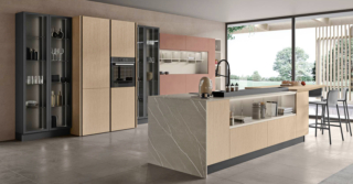 Si apre completamente sulla zona giorno la cucina Tablet di CREO Kitchens che ha uno stile  giovane e moderno, sottolineato dalla colorazione chiara. L'isola centrale è dotata di una penisola laterale con un'originale forma trapezoidale in melaminico bamboo nativo come le ante a terra delle colonne e delle basi. I pensili con le ante lisce in melaminico pietra Fulvus illuminano la composizione. Un modulo base senza top, prezzo 288 euro + IVA. www.creokitchens.it Si apre completamente sulla zona giorno la cucina Tablet di CREO Kitchens che ha uno stile  giovane e moderno, sottolineato dalla colorazione chiara. L'isola centrale è dotata di una penisola laterale con un'originale forma trapezoidale in melaminico bamboo nativo come le ante a terra delle colonne e delle basi. I pensili con le ante lisce in melaminico pietra Fulvus illuminano la composizione. Un modulo base senza top, prezzo 288 euro + IVA. www.creokitchens.it