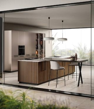 Nell'isola, le ante impiallacciate dogate Rovere Pecan sono valorizzate da maniglie verticali in metallo finitura antracite.La cucina Musa di Scavolini si completa di colonne con ante in laccato opaco effetto perlato Pas Dosé e vetrine con telaio Acciaio Scuro. I top sono in gres porcellanato Invisible Light e acciaio scuro. Prezzo da rivenditore. www.scavolini.com Nell'isola, le ante impiallacciate dogate Rovere Pecan sono valorizzate da maniglie verticali in metallo finitura antracite.La cucina Musa di Scavolini si completa di colonne con ante in laccato opaco effetto perlato Pas Dosé e vetrine con telaio Acciaio Scuro. I top sono in gres porcellanato Invisible Light e acciaio scuro. Prezzo da rivenditore. www.scavolini.com