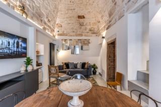 pranzo cucina salotto con cementine e soffitto volta