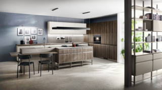 Cucina Formalia di Scavolini, design Vittore Niolu: isola con top in gres porcellanato Pietra Piasentina Grigio Naturale e ante in decorativo Noce Garden come il piano snack e le colonne a destra. Basi e pensili della composizione lineare sullo sfondo in laccato opaco Grigio Chiaro; sistema parete Status con struttura color Titanio. Cucina Formalia di Scavolini, design Vittore Niolu: isola con top in gres porcellanato Pietra Piasentina Grigio Naturale e ante in decorativo Noce Garden come il piano snack e le colonne a destra. Basi e pensili della composizione lineare sullo sfondo in laccato opaco Grigio Chiaro; sistema parete Status con struttura color Titanio.