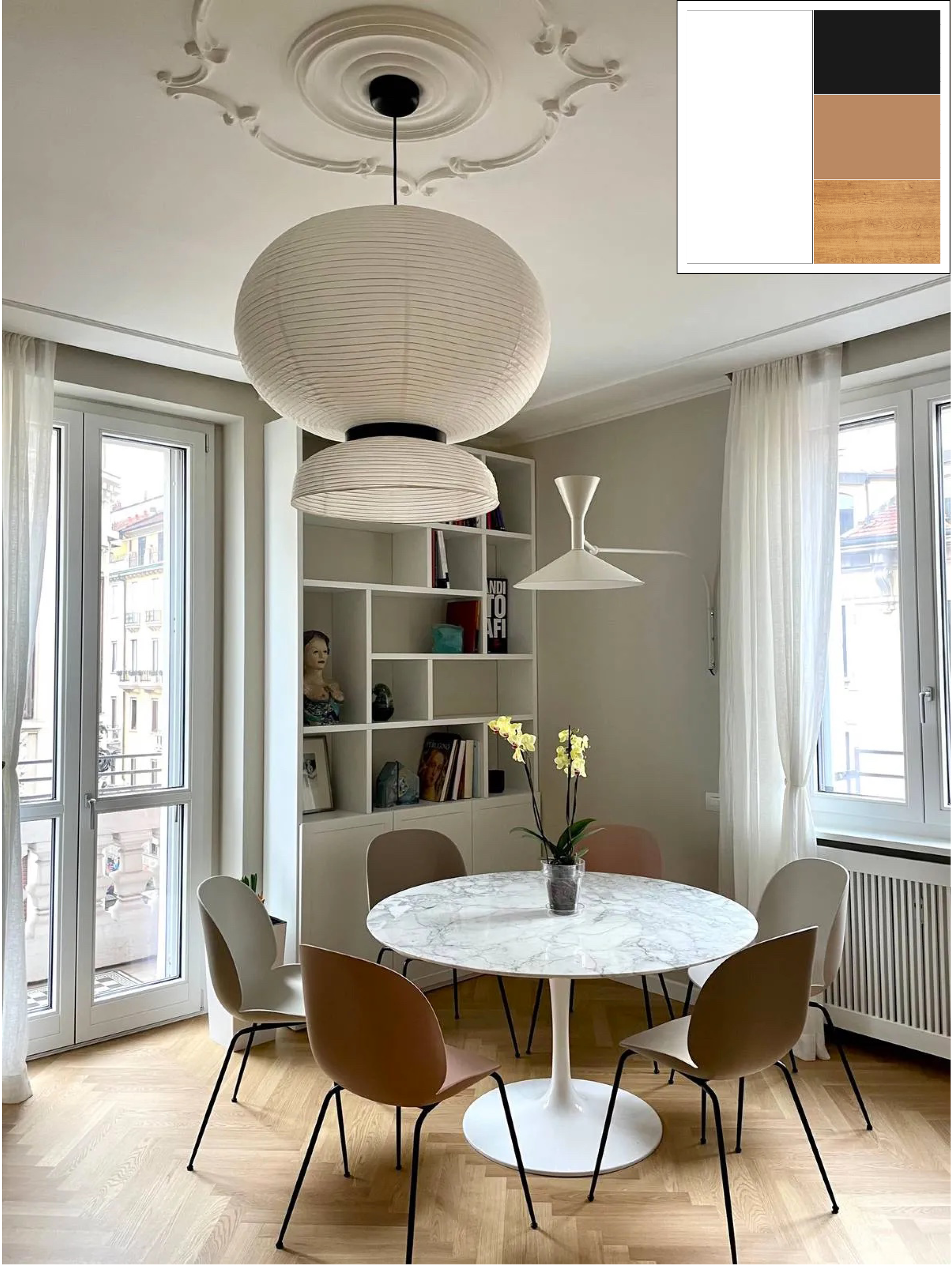 In questa sala da pranzo il tavolo tondo bianco è abbinato a sedie di design scelte in una palette calda e soft. La libreria bianca realizzata su disegno crea un piccolo contrasto con la parete dipinta in un bianco più caldo. Il soffitto con il grande rosone in stucco originale e la lampada in carta, sempre bianchi, completano l’atmosfera: tutti gli elementi dialogano tra loro in modo equilibrato e armonioso. In questa sala da pranzo il tavolo tondo bianco è abbinato a sedie di design scelte in una palette calda e soft. La libreria bianca realizzata su disegno crea un piccolo contrasto con la parete dipinta in un bianco più caldo. Il soffitto con il grande rosone in stucco originale e la lampada in carta, sempre bianchi, completano l’atmosfera: tutti gli elementi dialogano tra loro in modo equilibrato e armonioso.