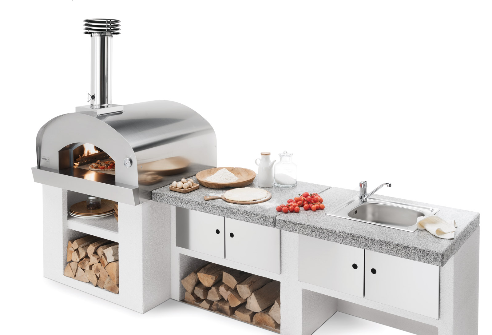 Palazzetti in Giardino: Carmine a legna
Per sfornare pizze e pane con tutto l’aroma della legna,  non serve avere grandi spazi. Carmine a legna della linea Palazzetti in giardino è un pratico forno a legna (fuoco diretto) da appoggio con un’area di cottura per due pizze. Realizzato in acciaio inox e refrattario, ha la particolare conformazione a volta, che, unitamente allo spesso isolamento in lana di roccia, consente il raggiungimento in breve tempo e con un minimo consumo di legna della temperatura ideale per cuocere pane e pizze. Ha la possibilità di essere integrato con tutti i moduli Cookie per la cucina outdoor. Misura 98 x 113 x 85 cm (vano interno forno 60 x 80 cm). https://ingiardino.palazzetti.it/