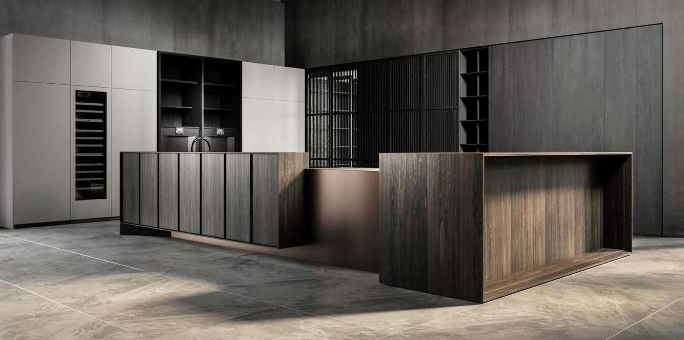 Viene presentata in anteprima durante il Fuorisalone la nuova cucina Tai_o di Key Cucine che si sviluppa intorno all'isola, racchiusa e protetta da moduli lignei in rovere fossile millenario e da elementi in peltro bronzato rivestiti in marmo Clauzetto , con una planimetria a L che separa e distanzia la zona lavoro dal living. Le colonne attrezzate e la boiserie che “vestono” le pareti sono cannettate in legno massello. https://www.keysbabo.com - Fuorisalone, Showroom Milano c/o Agape 12  – Via Statuto 12, Milano