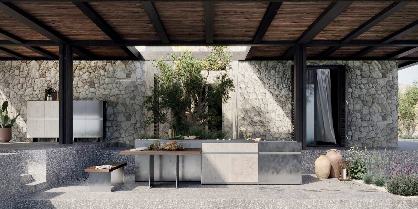 Loggia Out _ Santorini è la prima cucina per esterno di Zampieri: unisce tutti i comfort e i pregi di una cucina indoor a una robusta struttura in alluminio adatta alla vita all'aria aperta. Le ante hanno il profilo integrato effetto gola che le rende funzionali ed eleganti. I materiali utilizzati  sono stati selezionati per le loro qualità estetico-sensoriali e trattati per resistere nell'ambiente esterno, persino marino: dai metalli con finitura nichelata fino al legno massello di frassino termo-trattato.    https://zampiericucine.it - Fuorisalone, Zampieri Flagship Store – Via Molino delle Armi 48, Milano