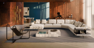 Il modello angolare Gilmour di Busnelli è caratterizzzato da una sapiente alternanza fra pieni e vuoti; è componibile grazie ai sedici moduli dotati di un basamento poggiante su esili piedini in metallo. È disponibile rivestito in tessuto o in pelle ed è sfoderabile. Lo schienale, formato da un unico pezzo, offre il massimo sostegno in ogni punto. Può essere completato con un piano di appoggio con il bordo rialzato e con un pratico contenitore a giorno, entrambi realizzati in frassino.        https://www.busnelli.com – Fuorisalone, Showcase Arrital – Corso Europa 22, Milano.