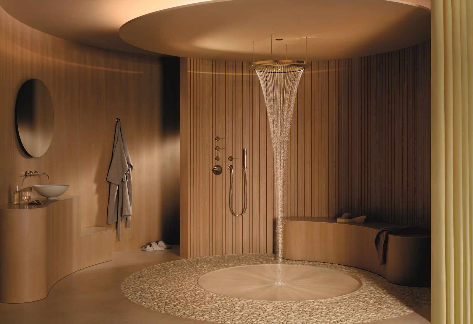 È una scultura d'acqua dalla forma ad anello la doccia emozionale Aquahalo di Dornbracht per la quale il designer Michael Neumayr ha tratto ispirazione dallo stile svedese gustaviano. Fissato in quattro punti, l’anello circonda il soffione centrale a soffitto con luce integrata. La doccia ha tre getti: con Aqua Circle Rain i morbidi getti che escono dall’anello centrale creano un cono d’acqua per una doccia dall’effetto rilassante e meditativo. Tempest Rain riproduce la sensazione della pioggia sulla pelle con getti multidirezionali, per un effetto distensivo ed energizzante. Diamond Rain unisce acqua e luce in un flusso cristallino piacevole sulla pelle e esteticamente accattivante. Aquahalo è disponibile in cinque finiture: cromo e champagne (22kt Oro), lucide e opache, oltre al nero opaco. www.dornbracht.com/it-ch/ – Fuorisalone, Brera, Showroom Dornbracht, Via Palermo 19A, Milano.