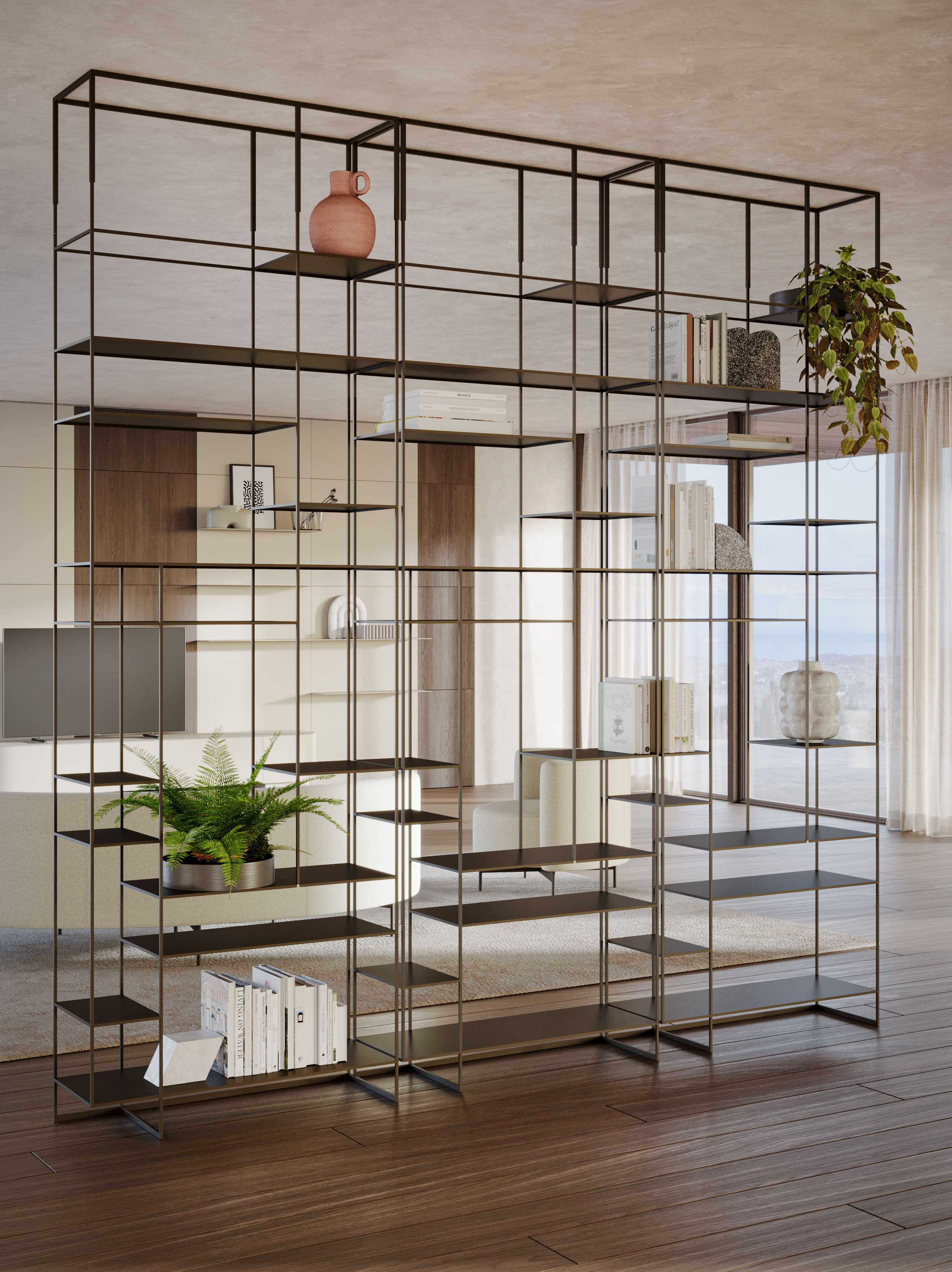 La libreria terra-cielo Levia Didier di Ronda design permette di separare due ambienti lasciando passare la luce; la struttura, alta e slanciata, è realizzata in in metallo verniciato a polveri in diverse varianti di colore con profili a sezione quadrata. I ripiani, regolabili in altezza e disposti asimmetricamente, si trasformano in un elemento decorativo. Misura L 90 x P 32 x H 240/261,8 cm.  https://rondadesign.it - Salone del Mobile, padiglione 5, stand A16.