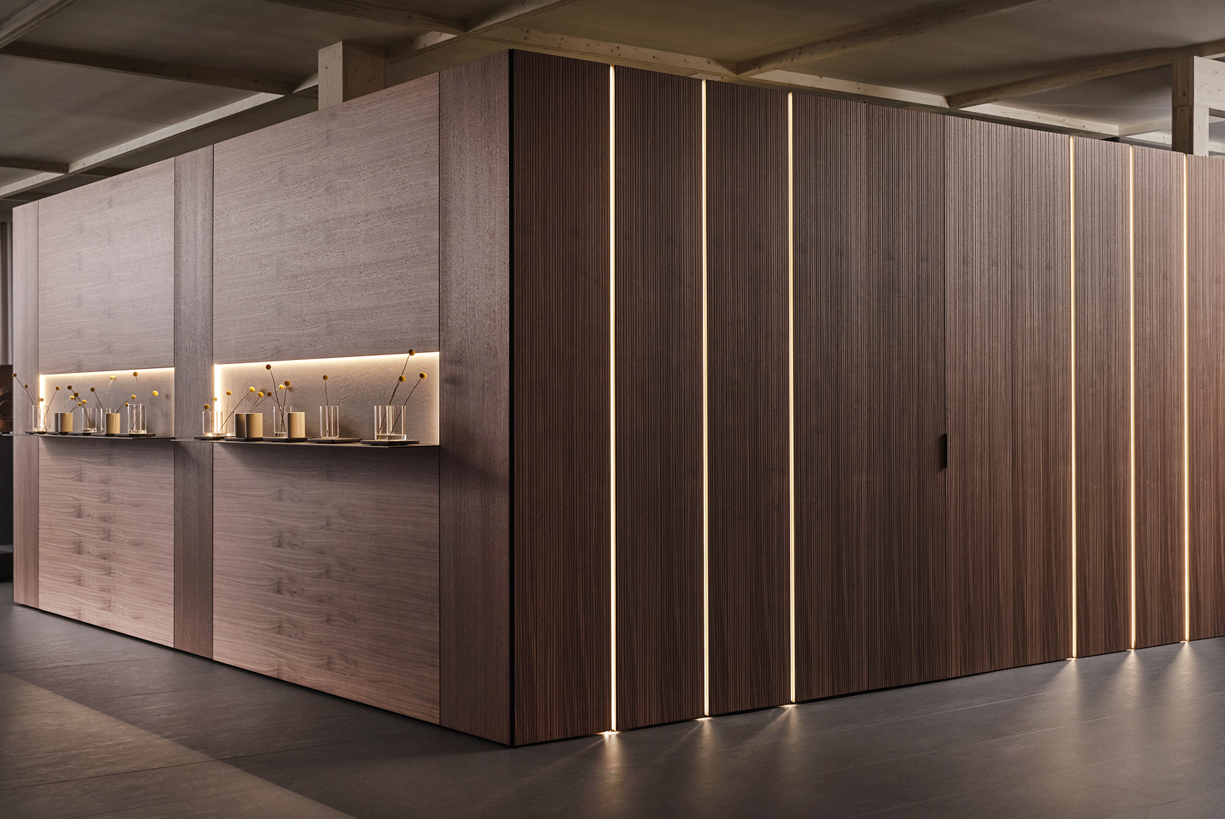 L'innovativo sistema Architype di Caccaro riveste la parete e si integra con Freedhome per dare vita ad un ambiente fluido dove gli spazi sono polifunzionali e perfettamente integrati tra loro L'utility area è racchiusa tra raffinate pareti in noce. https://www.caccaro.com - Salone del Mobile, padiglione 22, stand M22-M24.