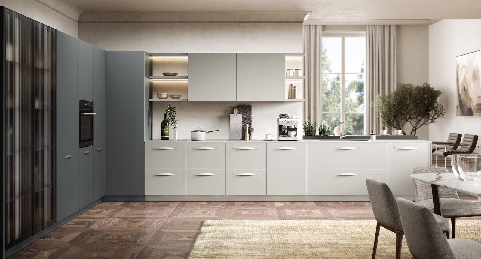 Due sfumature di grigio per il modello ad angolo Moon 2 di Moretti Compact Cucine che è composta da elementi in Laccato Opaco Grigio Luce e Ardesia Opaco con le maniglie ondulate nella stessa finitura dell'anta. Il piano di lavoro si allunga per terminare in un comodo piano snack; lateralmente trovano posto le colonne con ante in vetro Dogato Masterline, che lasciano intravedere l’interno della dispensa illuminata dal led incassato nel fianco. Un modulo base da 60 cm con anta battente, prezzo 248 euro + Iva. www.cucine.moretticompact.it Due sfumature di grigio per il modello ad angolo Moon 2 di Moretti Compact Cucine che è composta da elementi in Laccato Opaco Grigio Luce e Ardesia Opaco con le maniglie ondulate nella stessa finitura dell'anta. Il piano di lavoro si allunga per terminare in un comodo piano snack; lateralmente trovano posto le colonne con ante in vetro Dogato Masterline, che lasciano intravedere l’interno della dispensa illuminata dal led incassato nel fianco. Un modulo base da 60 cm con anta battente, prezzo 248 euro + Iva. www.cucine.moretticompact.it