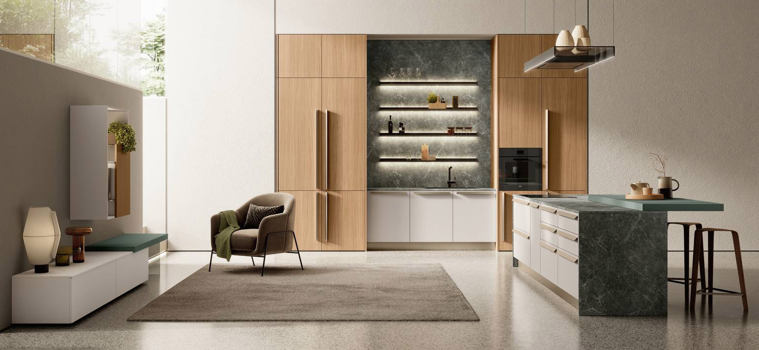 Nobilitato Noce e Laminato Marmo Guatemala per la cucina Modula di Febal Casa che si apre completamente sulla zona giorno. Il bancone snack in Fenix Verde Kitami, collocato in appoggio sul piano dell'isola con i fuochi, la trasforma in un palcoscenico durante la preparazione dei pasti. Le mensole Meta sopra la zona lavaggio sono dotate di illuminazione a Led che creano suggestivi giochi di luce sullo schienale della boiserie. Prezzo su richiesta. www.febalcasa.com Nobilitato Noce e Laminato Marmo Guatemala per la cucina Modula di Febal Casa che si apre completamente sulla zona giorno. Il bancone snack in Fenix Verde Kitami, collocato in appoggio sul piano dell'isola con i fuochi, la trasforma in un palcoscenico durante la preparazione dei pasti. Le mensole Meta sopra la zona lavaggio sono dotate di illuminazione a Led che creano suggestivi giochi di luce sullo schienale della boiserie. Prezzo su richiesta. www.febalcasa.com