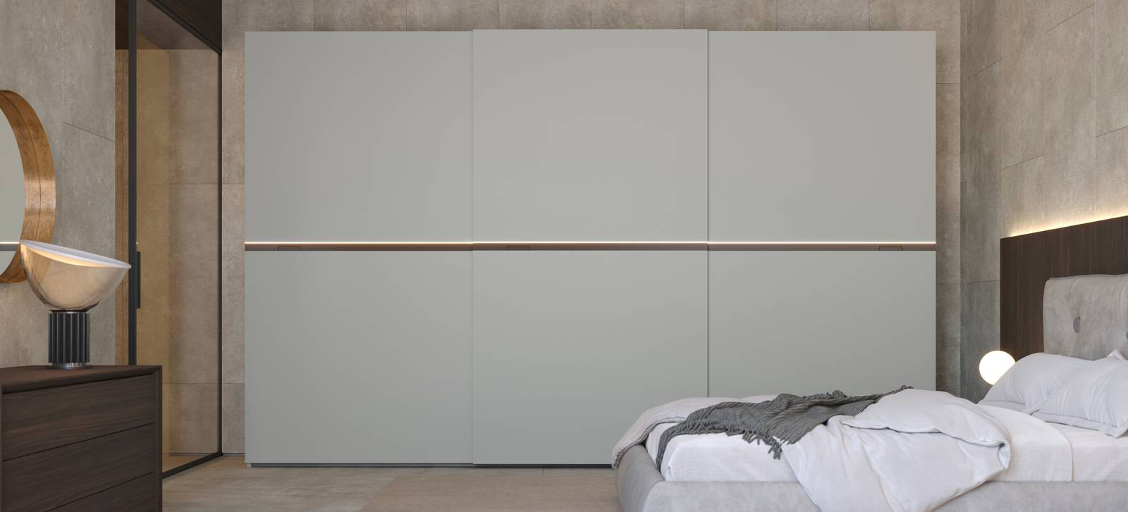 Ante scorrevoli in nobilitato color gesso, dotate di illuminazione a Led, per l'armadio New Slide di Giessegi che è facile da ambientare. Ogni modulo ha la seguente dotazione interna: un ripiano, due tubi appendiabiti ed ammortizzatori di serie per apertura e chiusura. Misura L 413,8 x P 61/66 x H 262 cm. Prezzo 4.696 euro + Iva. www.giessegi.it