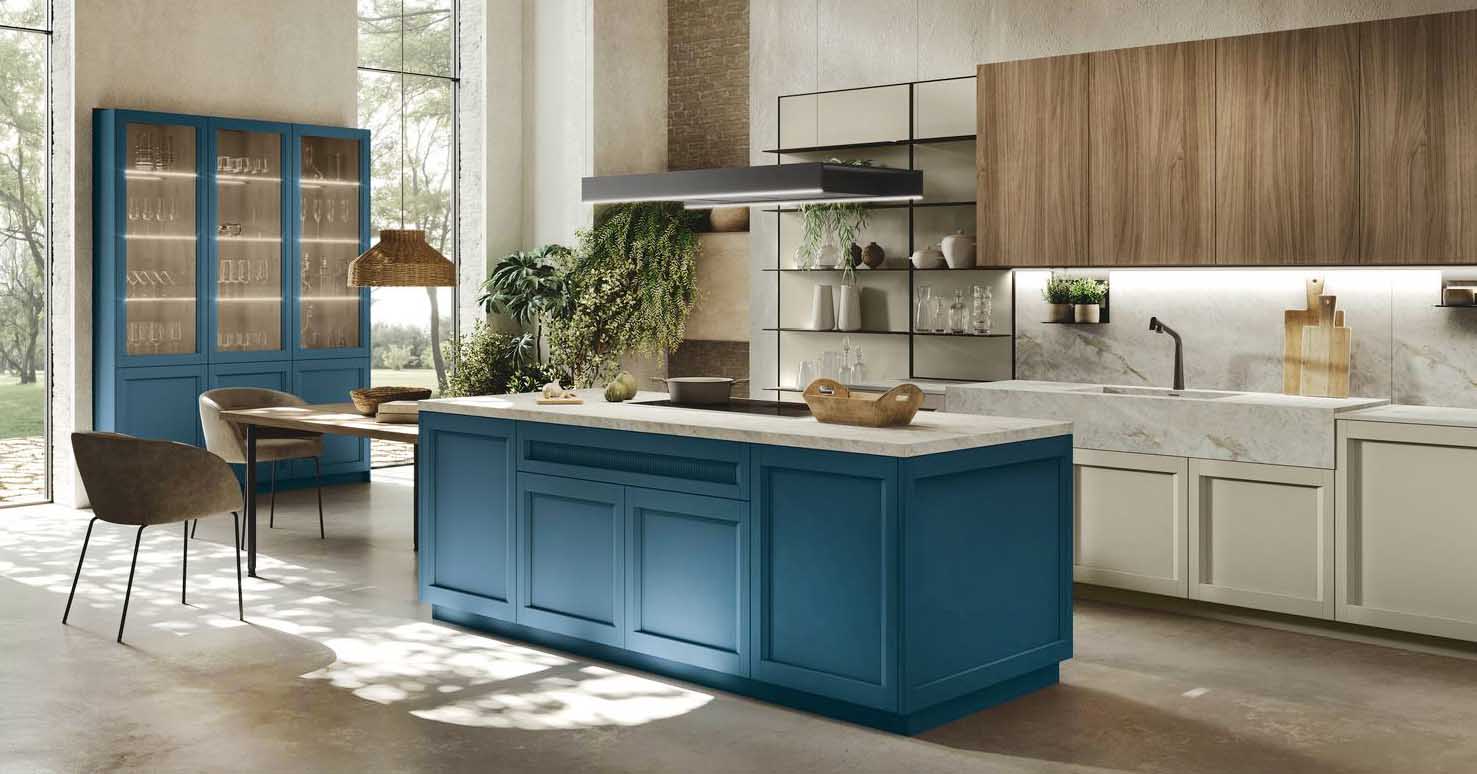 Ante a telaio per la cucina Palio di Stosa che si articola in una composizione lineare, con le basi in laccato opaco finitura Pomice, e in un'isola con le basi in laccato opaco Blue Storm; il piano di lavoro è realizzato in Neolith®  nella finitura Everest Sunrise Silk. I pensili sono in termo strutturato nella finitura Noce Eucalipto. Un modulo base da 60 cm, prezzo  a partire da 307 euro + IVA. www.stosacucine.com Ante a telaio per la cucina Palio di Stosa che si articola in una composizione lineare, con le basi in laccato opaco finitura Pomice, e in un'isola con le basi in laccato opaco Blue Storm; il piano di lavoro è realizzato in Neolith®  nella finitura Everest Sunrise Silk. I pensili sono in termo strutturato nella finitura Noce Eucalipto. Un modulo base da 60 cm, prezzo  a partire da 307 euro + IVA. www.stosacucine.com
