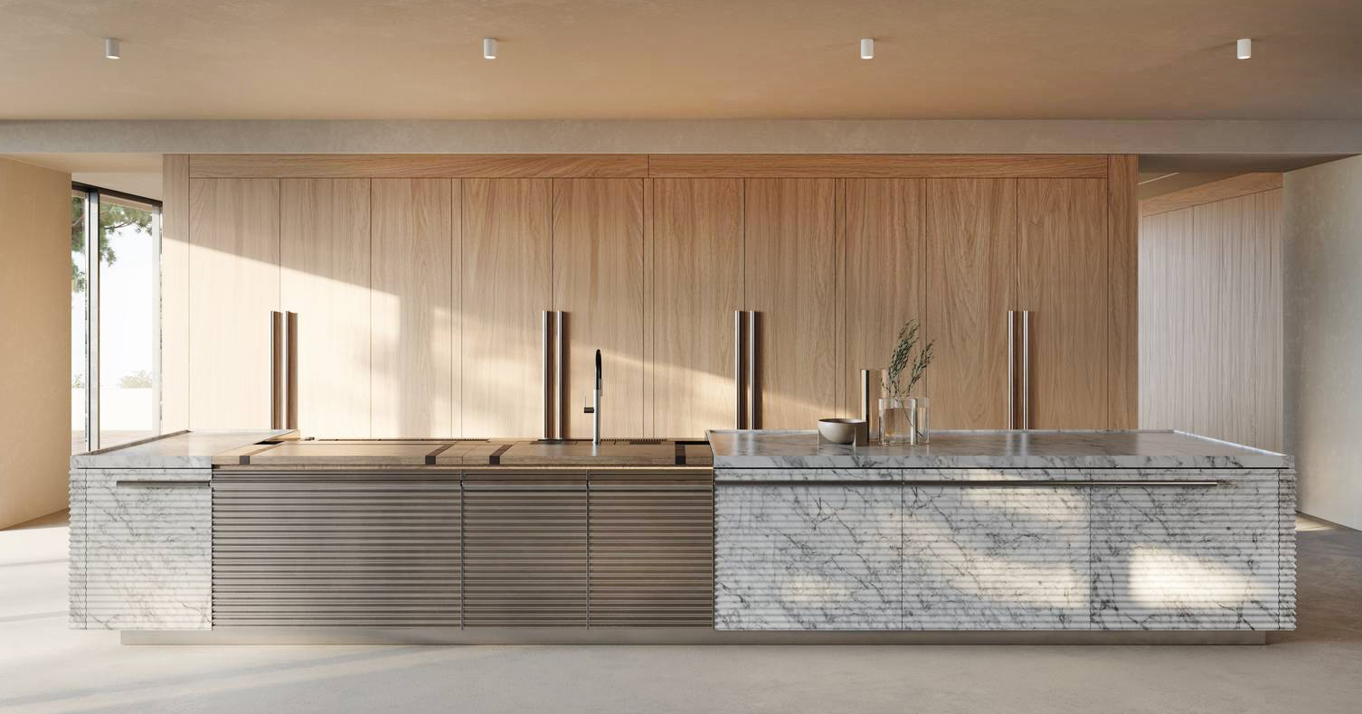 Pregiata pietra naturale e alluminio anodizzato per la grande isola che domina l'iconica cucina Cinqueterre di Schiffini progettata da Vico Magistretti, indimenticato maestro del design italiano: è attrezzata con lavandino e piano cottura con cappa integrata. La maniglia mantiene la sezione originaria e si estende sull'intera lunghezza. Prezzo su richiesta. www.schiffini.it