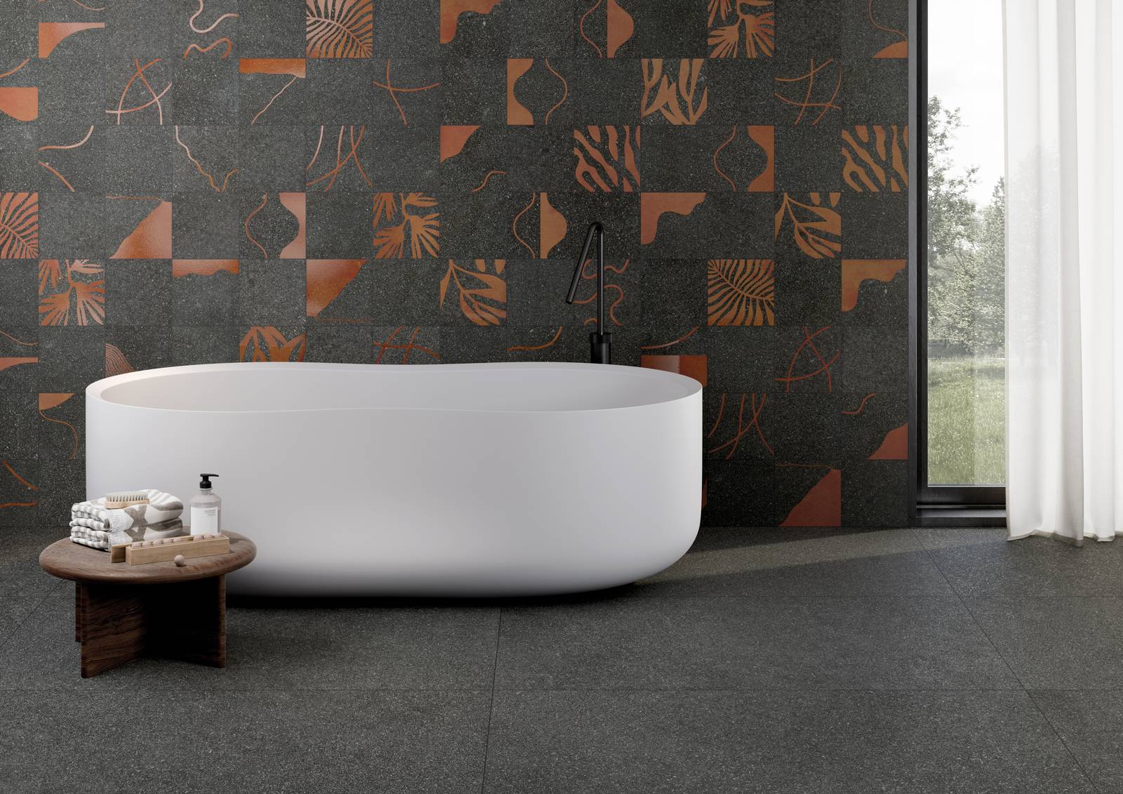 Nell’immagine raffinato ambiente bagno realizzato con Lavica, la collezione di Ceramiche Keope che cattura l’essenza della pietra vulcanica siciliana. A Parete il decoro Vulcano Anthracite (20x20) e a pavimento la finitura Anthracite nel formato 60x120 cm.