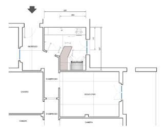 La cucina ha una pianta articolata e cuna zona ripostiglio. Per mantenerla separata e ingrandirla, potendovi sistemare una penisola, una base ribassata, il grande frigorifero a due ante recuperato dalla casa precedente ed i pensili si elimina il vano di servizio.