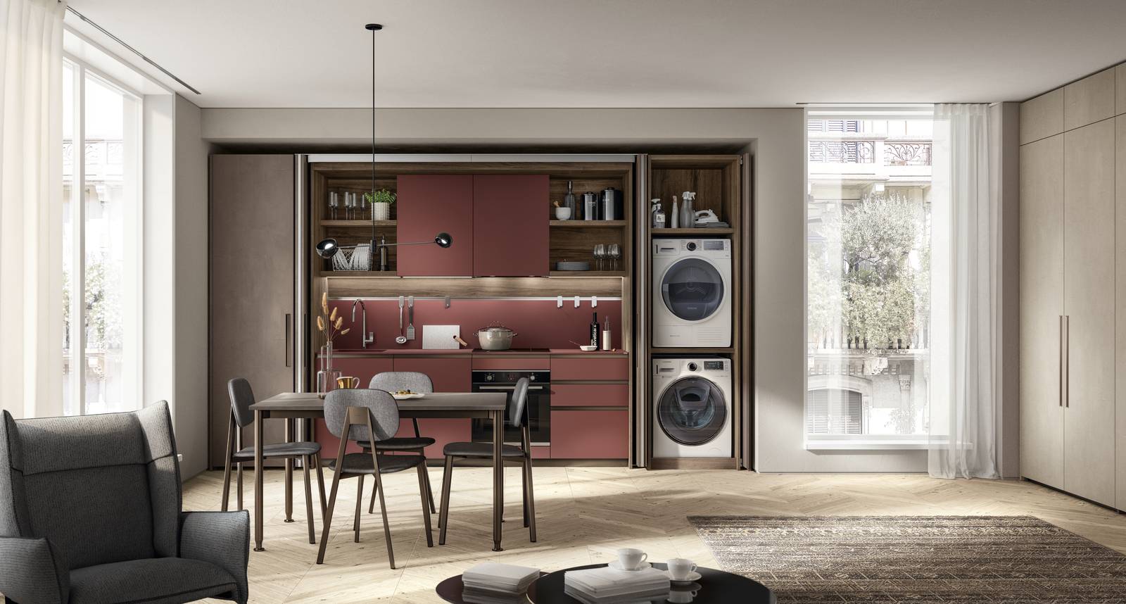 Fa parte del programma di arredo BoxLife di Scavolini, la cucina Boxi dotata di una sezione lavanderia in cui sistemare la lavatrice e l'asciugatrie impilate. Le ante ante, i piani e gli schienali sono realizzati in Fenix® Rosso Jaipur; i profili delle maniglie e gli zoccoli nella finitura Bronzo scandiscono la superficie. La struttura è in Noce Garden, mentre le ante esterne sono in Argilla Granada. Prezzo su richiesta. www.scavolini.com