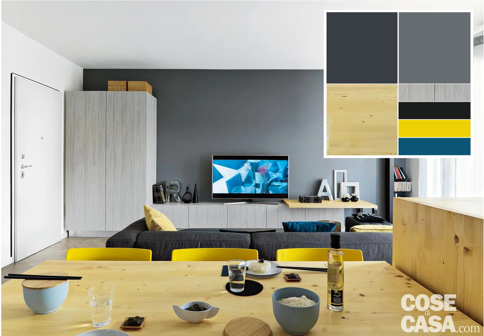 Nelle case di carattere moderno il grigio antracite diventa spesso il protagonista delle pareti principali, come in questo caso del salotto. Il grigio che è stato poi ripreso dalla tinta del divano, il tutto scaldato dal contrasto con i mobili in legno naturale e il giallo brillante delle sedie e dai cuscini - Foto: Adriano Pecchio. Styling Laura Mauceri. Progetto: arch. Alessandra Radice, D3 Architetti. Nelle case di carattere moderno il grigio antracite diventa spesso il protagonista delle pareti principali, come in questo caso del salotto. Il grigio che è stato poi ripreso dalla tinta del divano, il tutto scaldato dal contrasto con i mobili in legno naturale e il giallo brillante delle sedie e dai cuscini - Foto: Adriano Pecchio. Styling Laura Mauceri. Progetto: arch. Alessandra Radice, D3 Architetti.